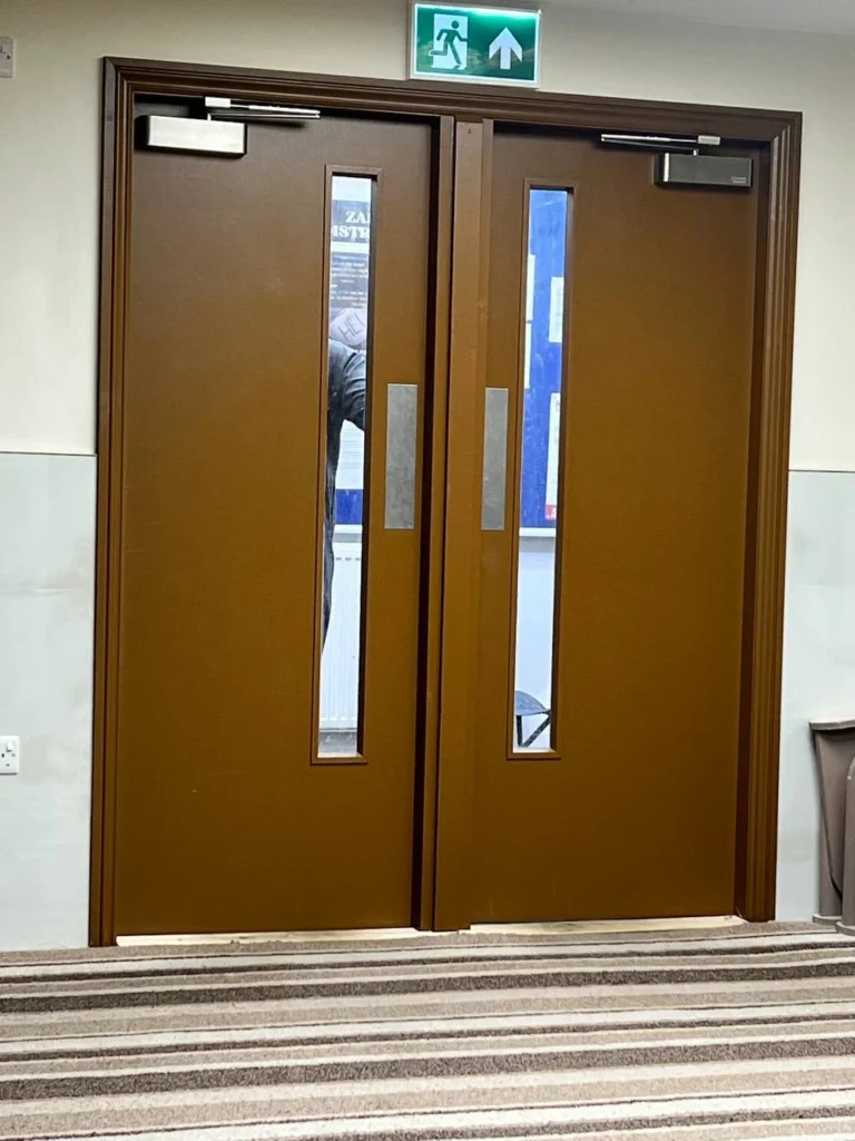 Painted prayer-hall entrance doors.