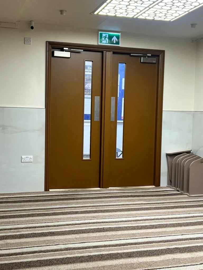The painted double doors from inside the prayer hall.
