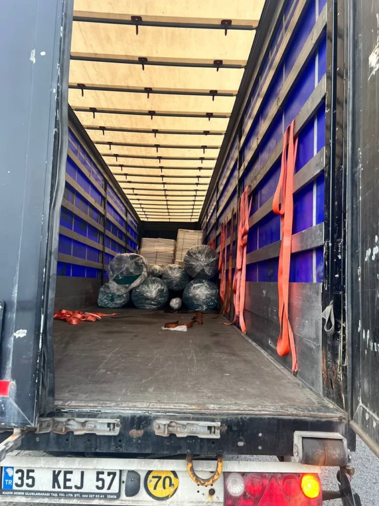 The new carpet rolls in the delivery vehicle.