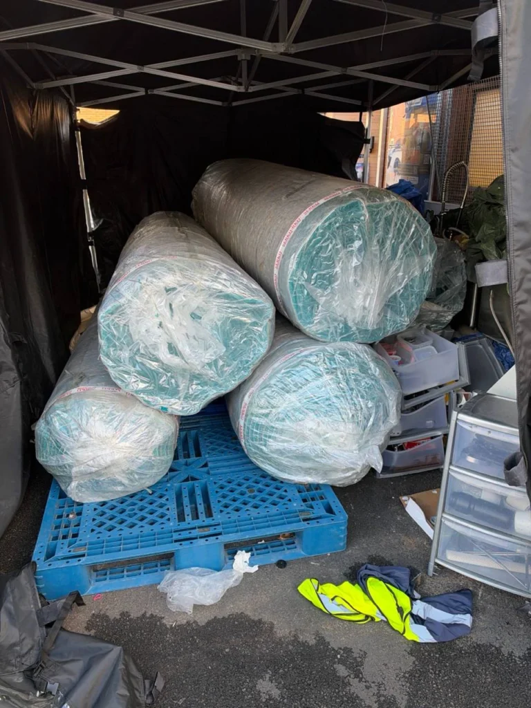 The carpet rolls stored after delivery.
