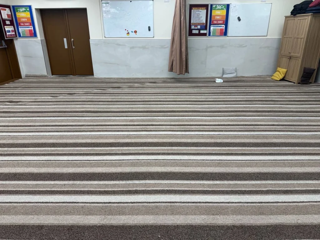 The original carpet across the musalla before fitting.
